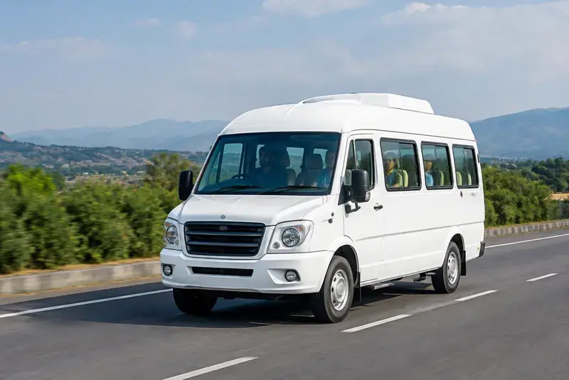 Traveller 12 seater driving on an Indian highway